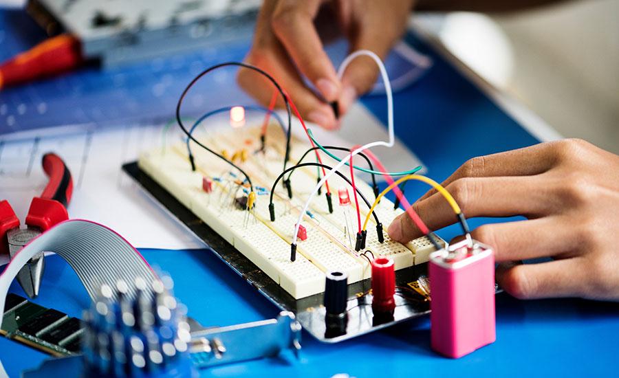 Student designing a circuit 